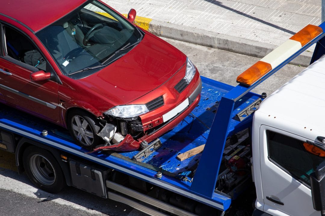 crashed-car-loaded-on-a-tow-truck.jpg